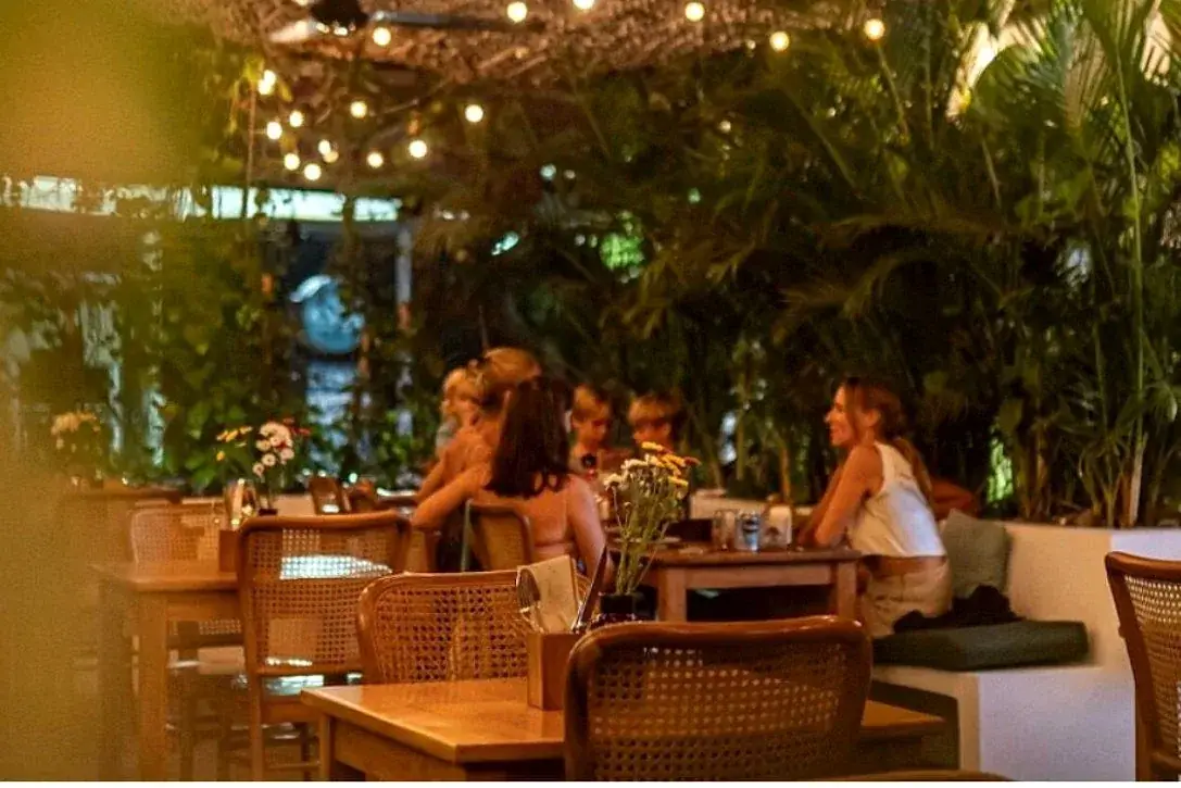 A garden restaurant under festoon lighting in Uluwatu